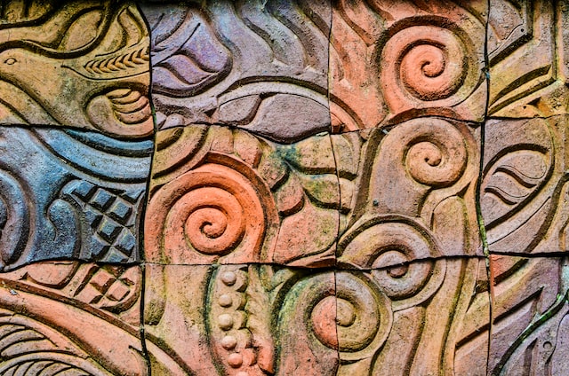 wood carving with pastel color paint on top